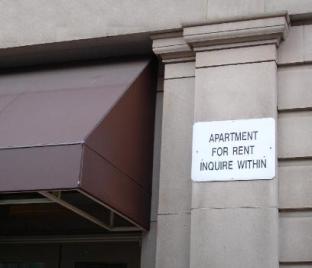 This photo of a sign indicating Apartments For Rent was taken by photographer David Lat from Washington, DC.